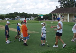 Junior golf kids getting lessons from pga instructors