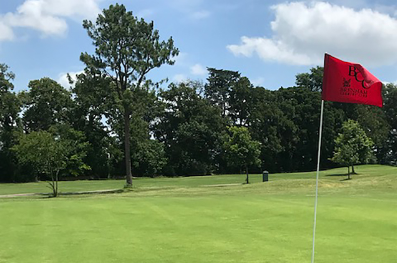 BCC flag waves in the wind on the golf course